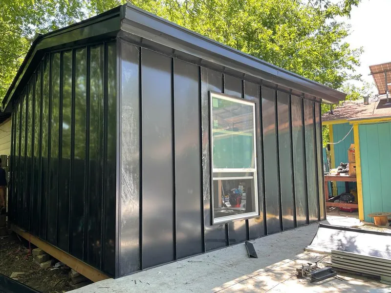 Black standing seam metal wall panels for Roof Inspection in West Point