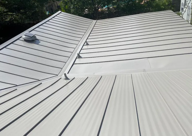 Solar attic fan installed on a metal roof for Roof Ventilation in West Point